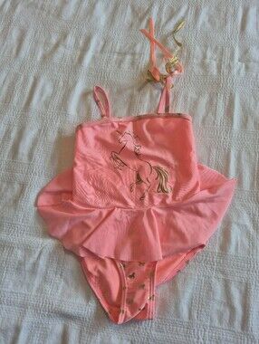 Hula Star girls neon pink 1 piece unicorn swim suit, leg elastic is loose